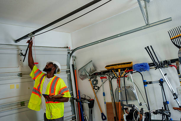 Professional Garage Door Panel Replacement technician working in East End, AR